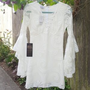 Bebe Jane Lace Bell Sleeve Dress. Lace up Bust. 4